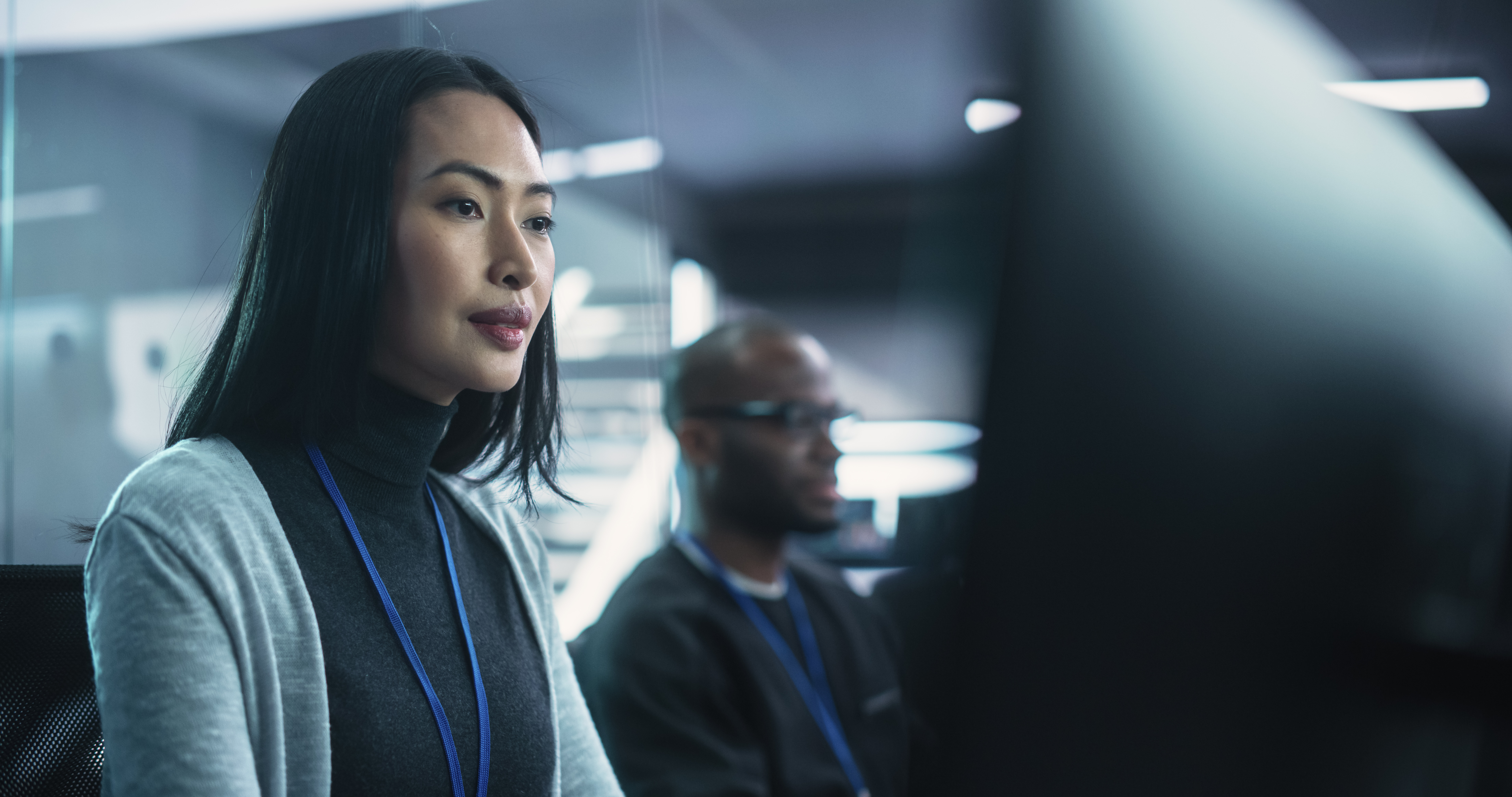 Cybersecurity professional monitoring AI-driven security systems in an enterprise operations environment.