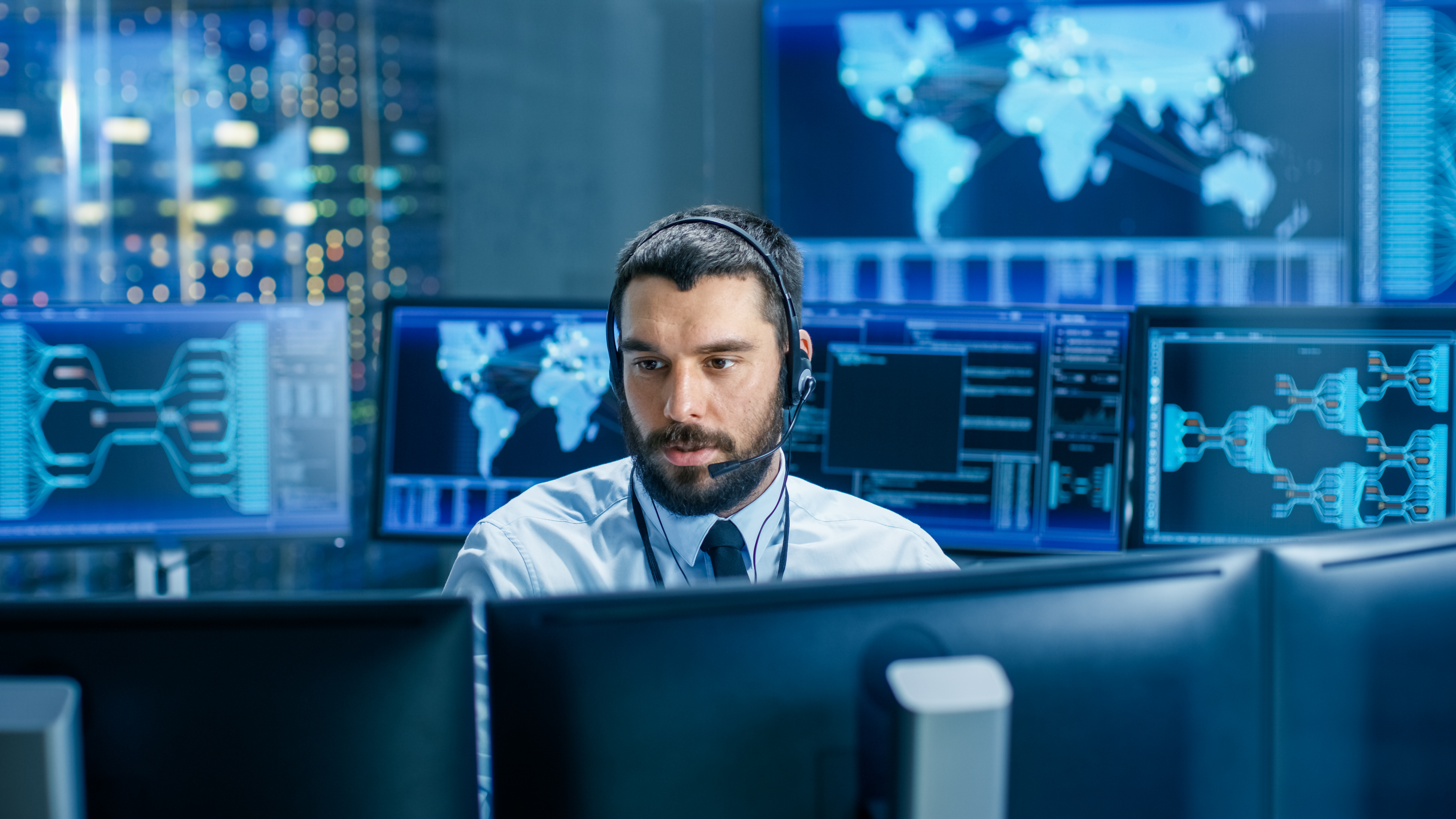 IT operations professional monitoring AI systems across multiple regional data centers to ensure compliance and sovereignty