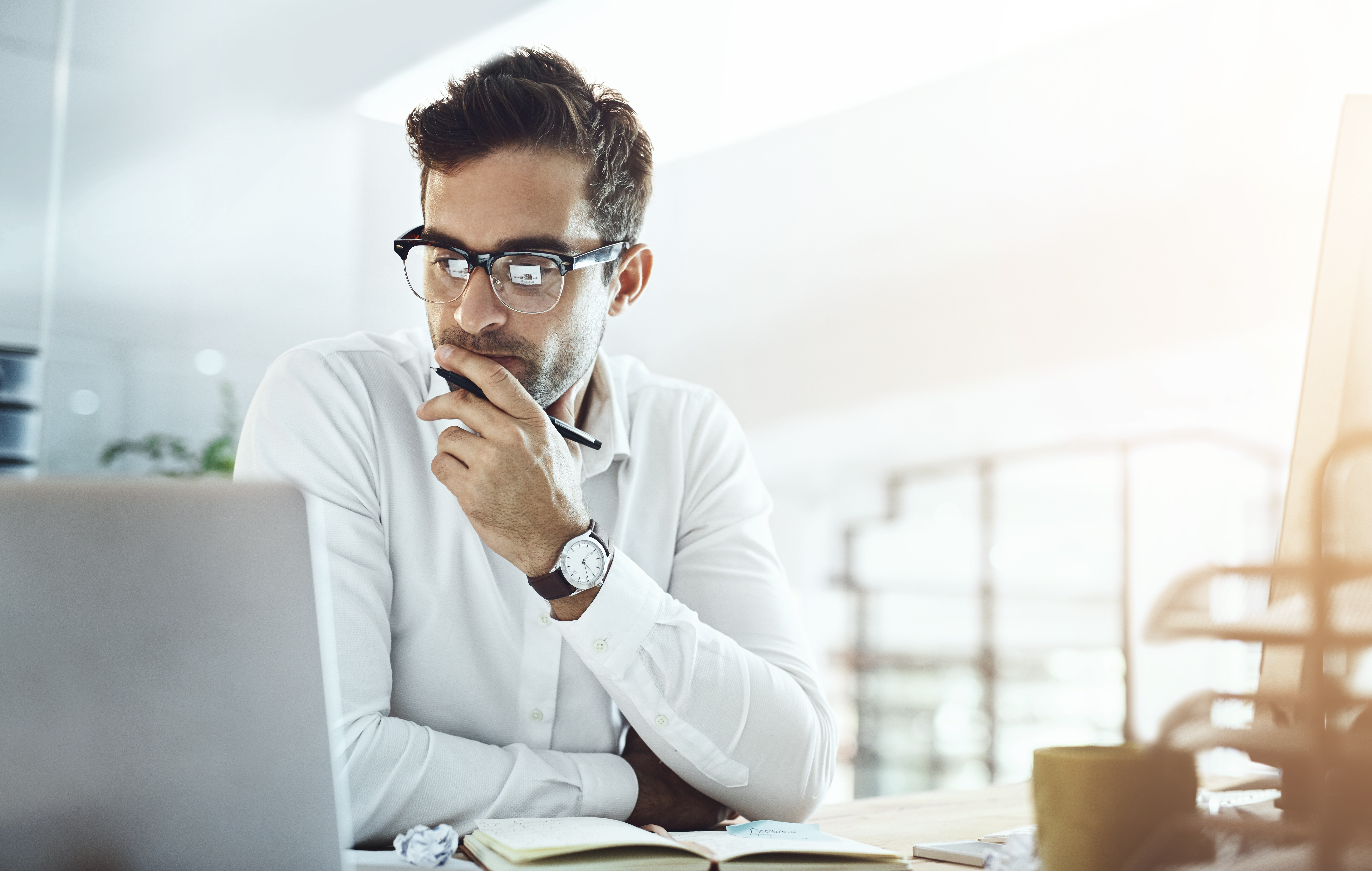 Business professional evaluating AI research output at desk — IDC Quanta trustworthy by design